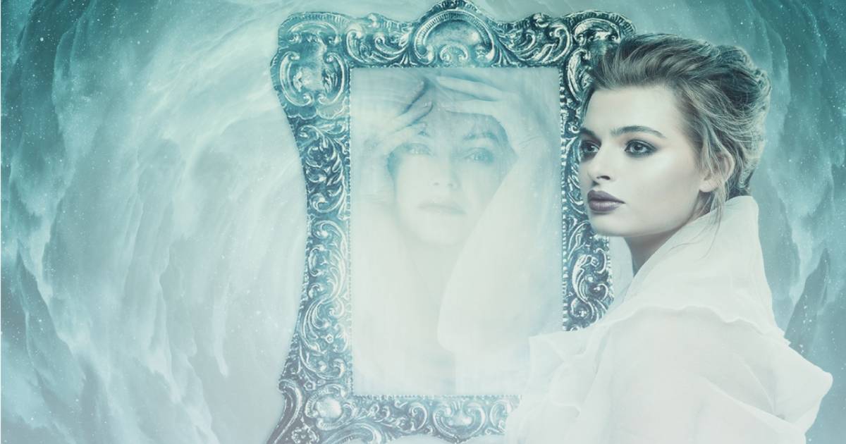 MIRRORS IN DREAMS woman seeing her reflection in a vintage mirror inside an old castle